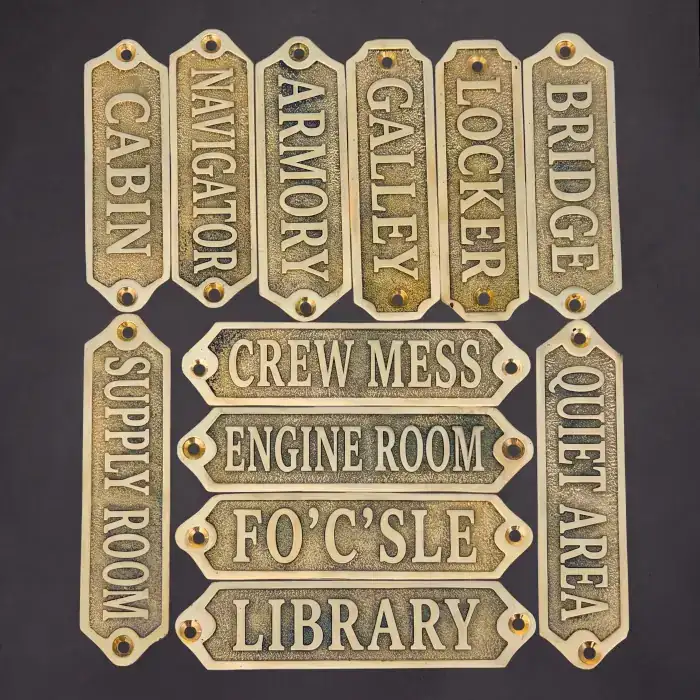 A collection of deeply etched brass nautical nameplates, such as "Engine Room" and "Bridge." We provide the precise, machine-ready vector files required for chemical etching and CNC routing of custom metal signs.
