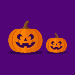 Two happy jack o lantern pumpkins on purple background